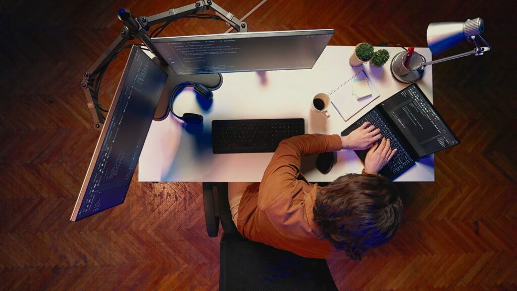 Top down view of hyperactive developer suffering from adhd, doing multitasking