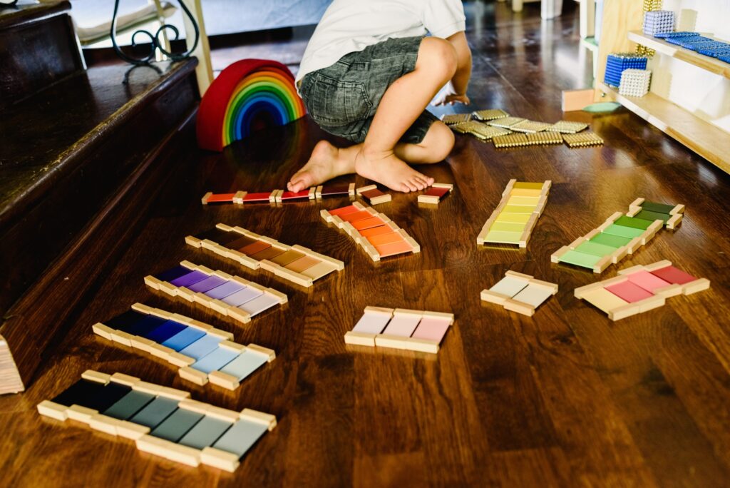 Children playing and learning with montessori color tablets
