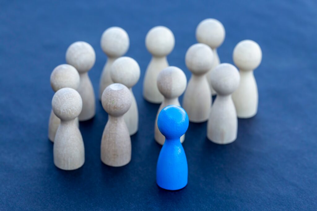 To be different, to be a leader, to lead. icon expression with colorful wooden figures.