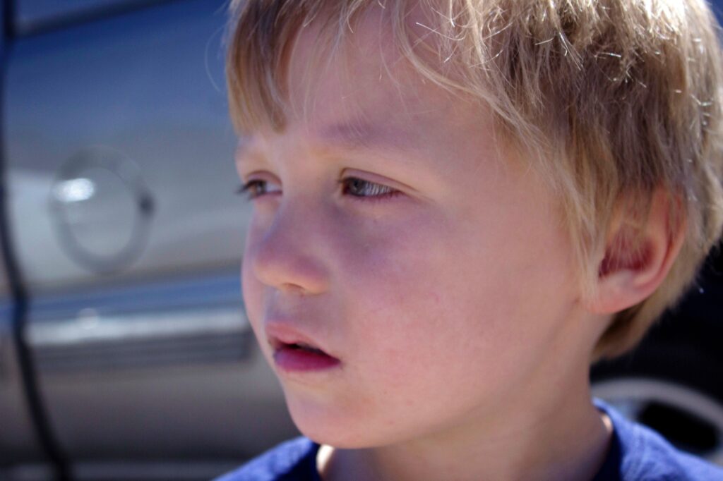 Pensive / emotional little boy