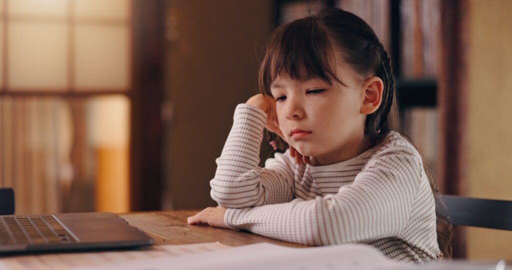 Girl, child and bored with homework, reading and frustrated with learning disability, tired or adhd