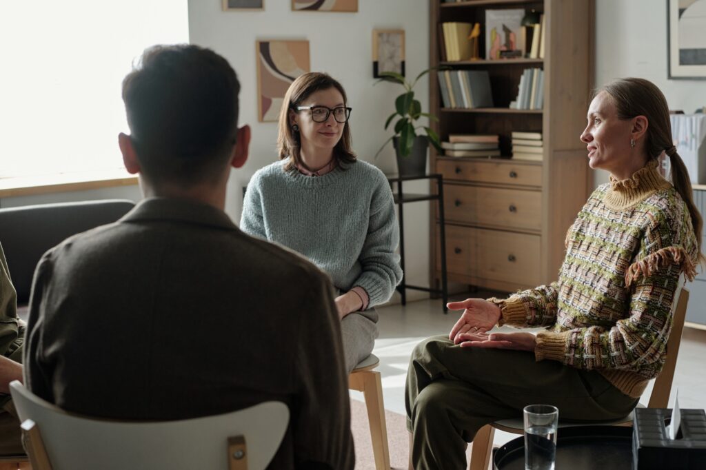 Group of and Women Discussing Therapy Issues